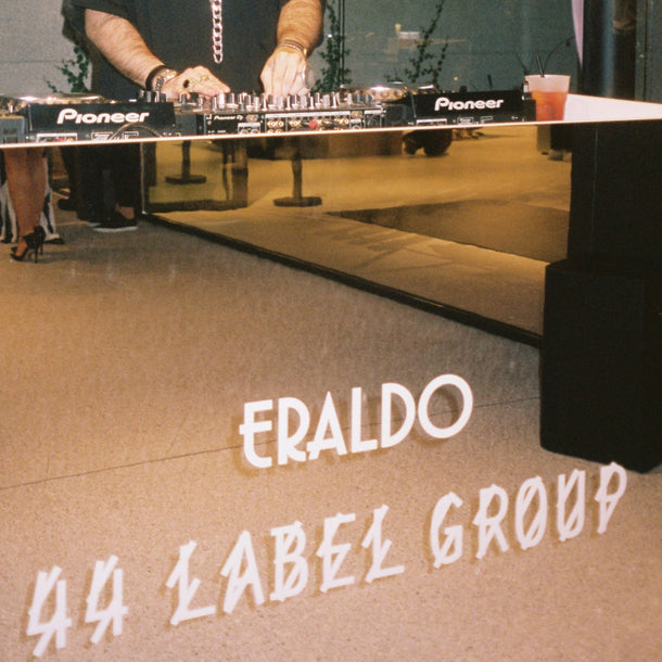 44 Label Group x Eraldo collaboration logo sticker displayed on the DJ set during the AW24 event at Eraldo Store Jesolo.
