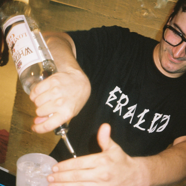 Close-up of a bartender preparing a cocktail during the 44 Label Group AW24 event at Eraldo Store Jesolo.