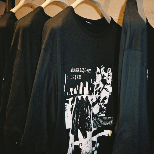 Black T-shirts from the Ann Demeulemeester AW25 collection displayed inside Eraldo Store Jesolo during the event.