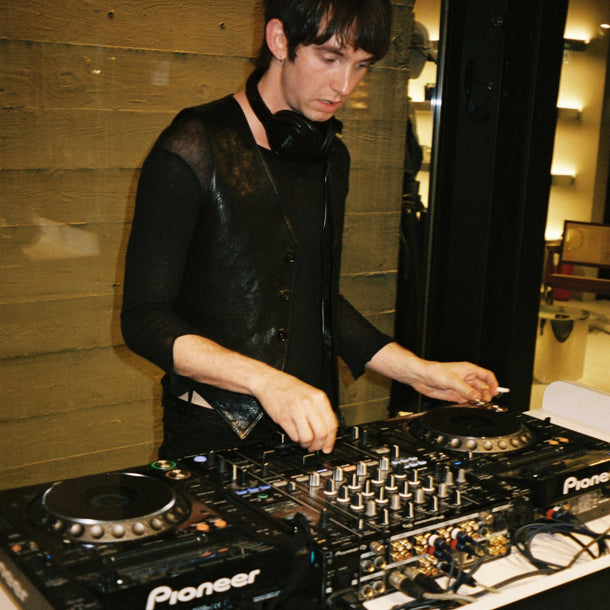 DJ performing during the Ann Demeulemeester AW25 event at Eraldo Store Jesolo.