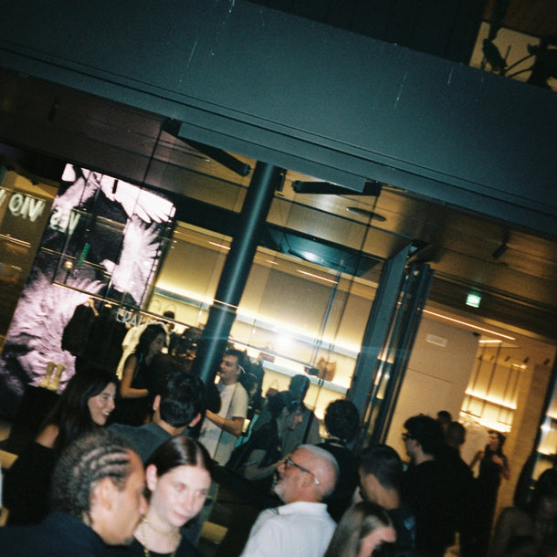 Eraldo Store Jesolo storefront and guests attending the Ann Demeulemeester AW25 event from the street.