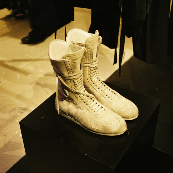 White Ann Demeulemeester AW25 shoes displayed in the Eraldo Store Jesolo window during the event.