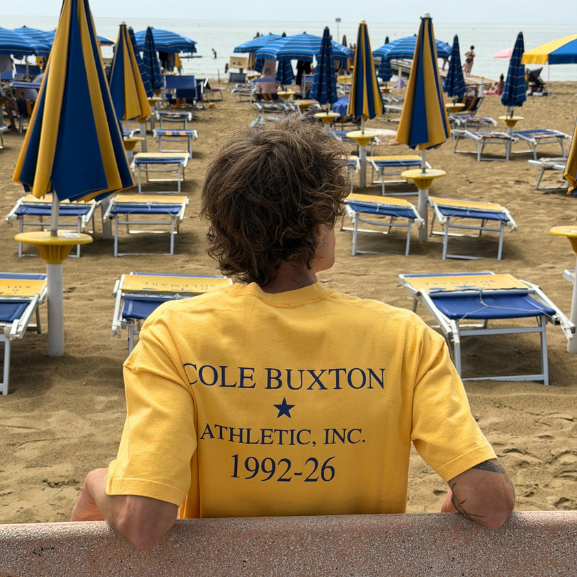 Men's Fall Winter 2026 new arrivals featuring a Cole Buxton yellow graphic T-shirt with contrasting blue logo and lettering