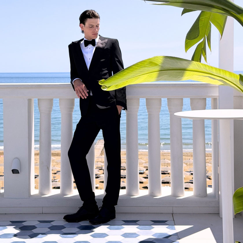 Men's Fall Winter 2026 new arrivals featuring a black Tom Ford tuxedo, Dolce&Gabbana shirt, Tom Ford bow tie and Church's shoes
