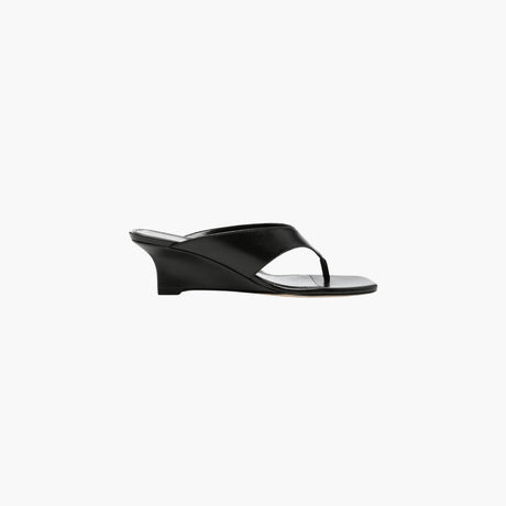 Black wedge heel sandals by Stuart Weitzman