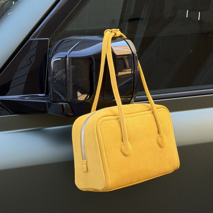 Women's Fall Winter 2026 new arrivals featuring a Margesherwood yellow suede leather tote bag with an embossed logo and long top handles