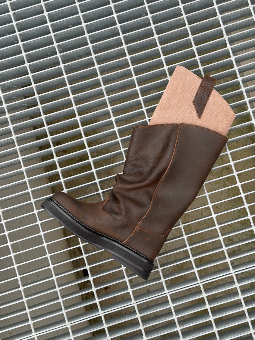 Women's Fall Winter 2026 new arrivals designer shoes featuring The Attico New Robin Passeggiata slouchy-design combat boots in brown leather