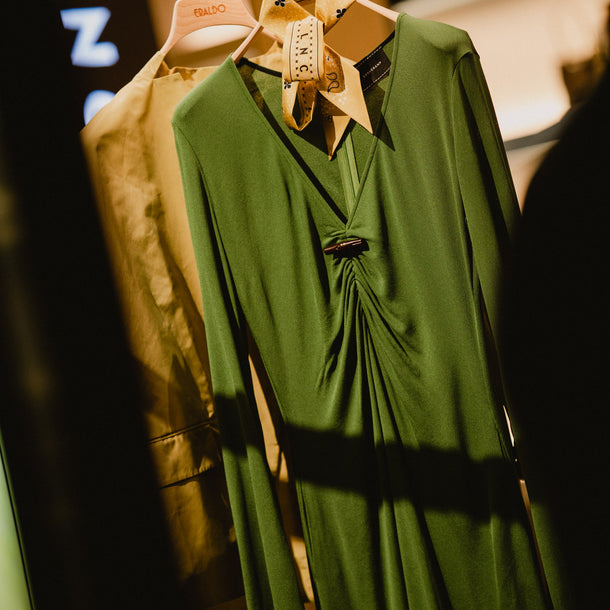 Long green dress from the Longchamp AW26 prêt-à-porter collection displayed at Eraldo Store Jesolo.