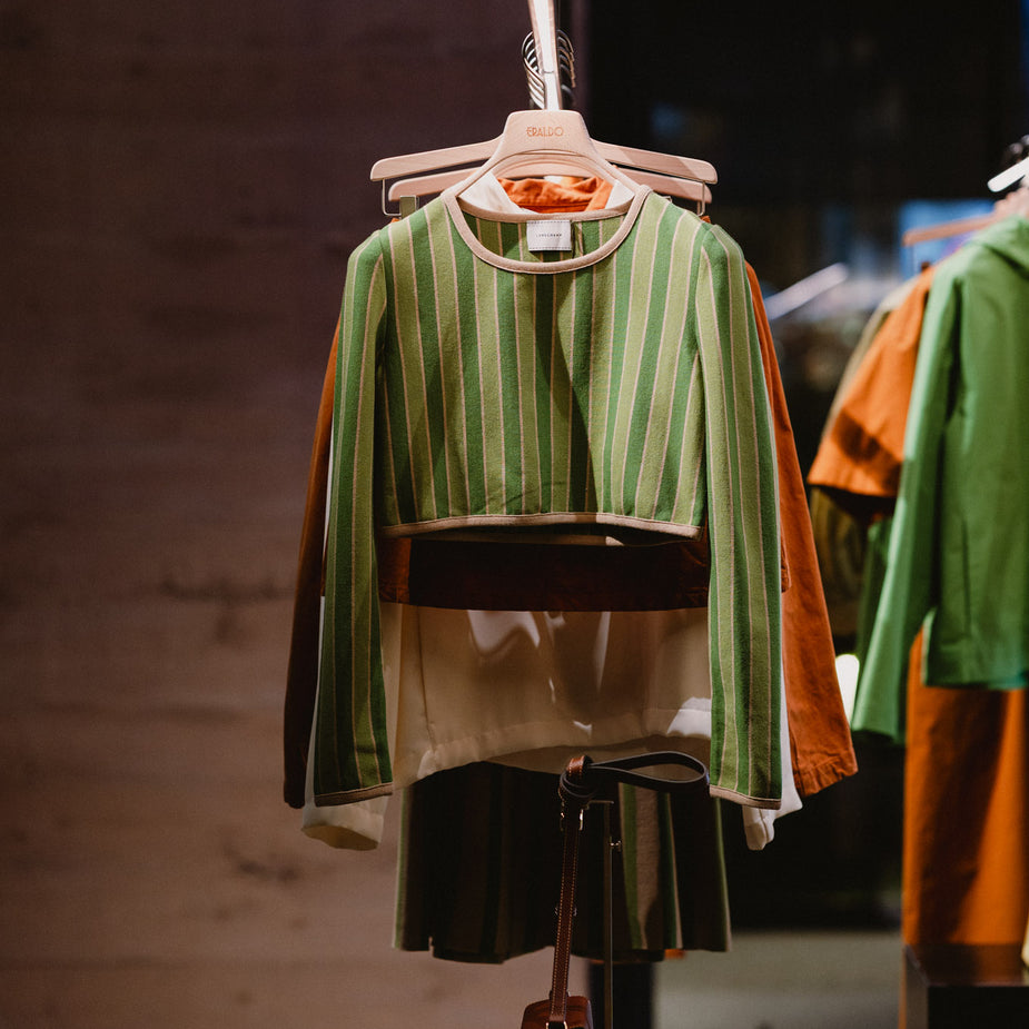 Selected garments from the Longchamp Fall Winter 2026 prêt-à-porter collection displayed during the event at Eraldo Store Jesolo.