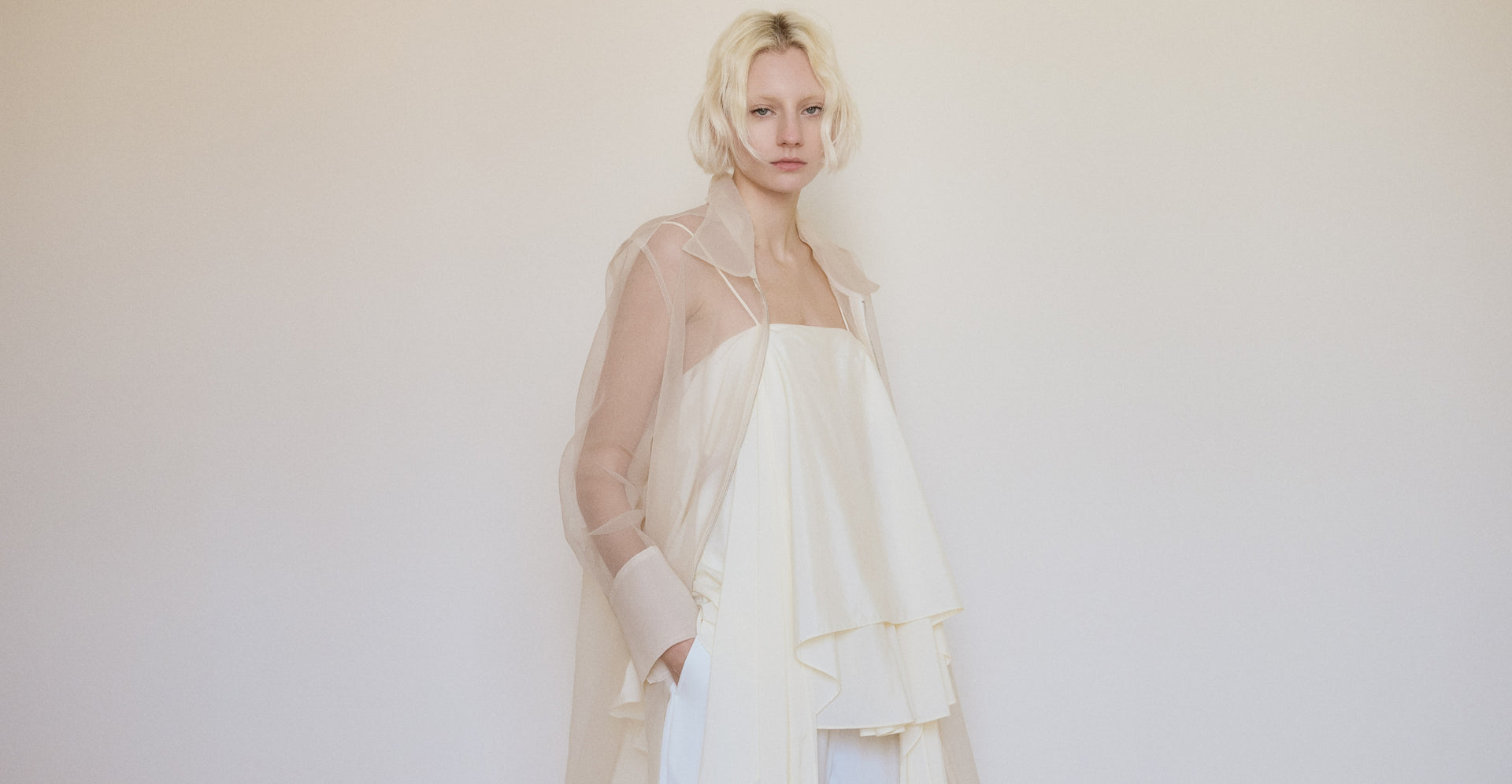 Elegant female model in neutral toned modern fashion look