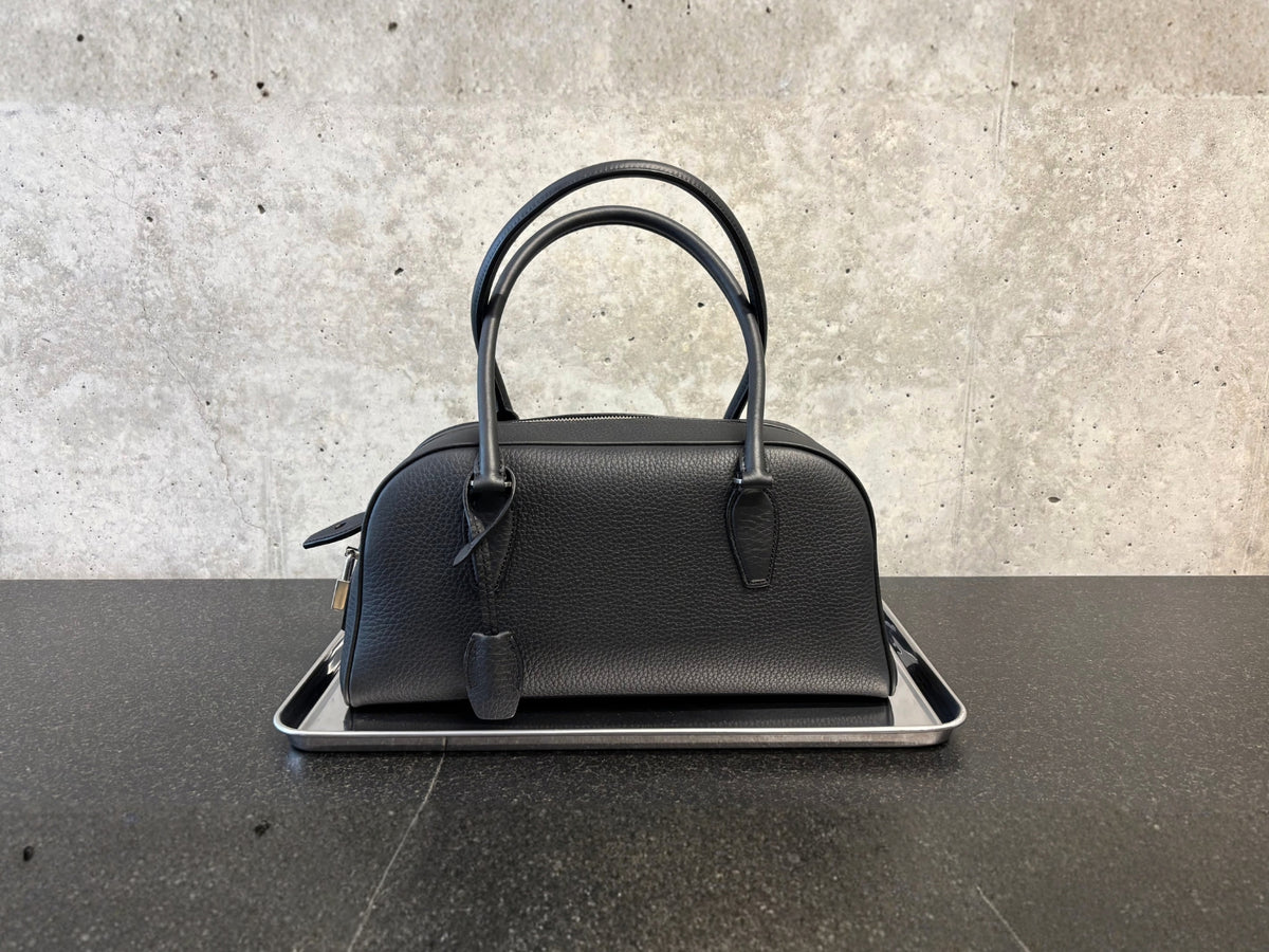 Women's New Arrivals 26 featuring a The Row leather bag placed on a silver tray.