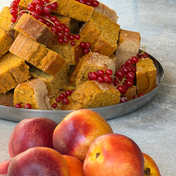 Banana bread and peaches prepared by Calamarata and served during The Andamane AW26 A Morning by the Sea breakfast at Eraldo Store Jesolo.