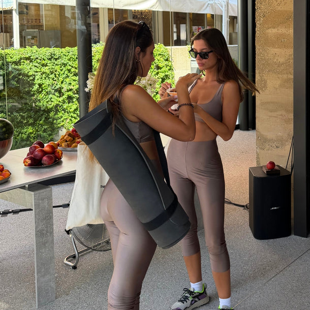 Two guests enjoying breakfast at Eraldo Store Jesolo after the beach yoga session during The Andamane AW26 A Morning by the Sea event.