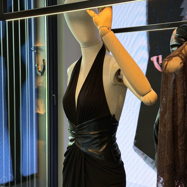 Mannequin wearing a dress from The Andamane AW26 new collection inside Eraldo Store Jesolo.