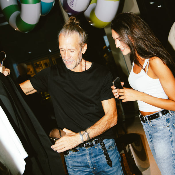 Guests browsing and examining garments from The Frankie Shop Autumn/Winter 26 collection during the event at Eraldo Store Jesolo
